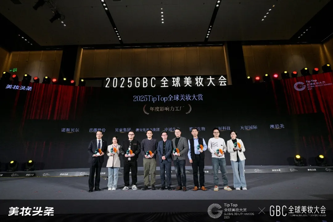 Group photo of DEVA International representatives receiving the award on stage