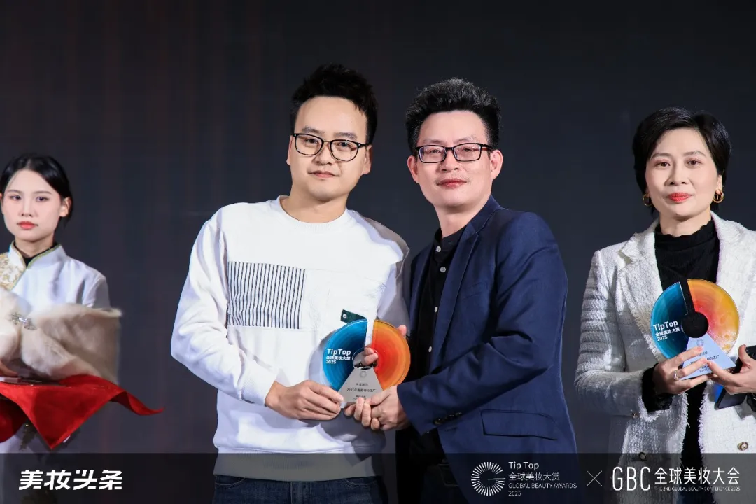 Close-up of a DEVA International representative receiving the award